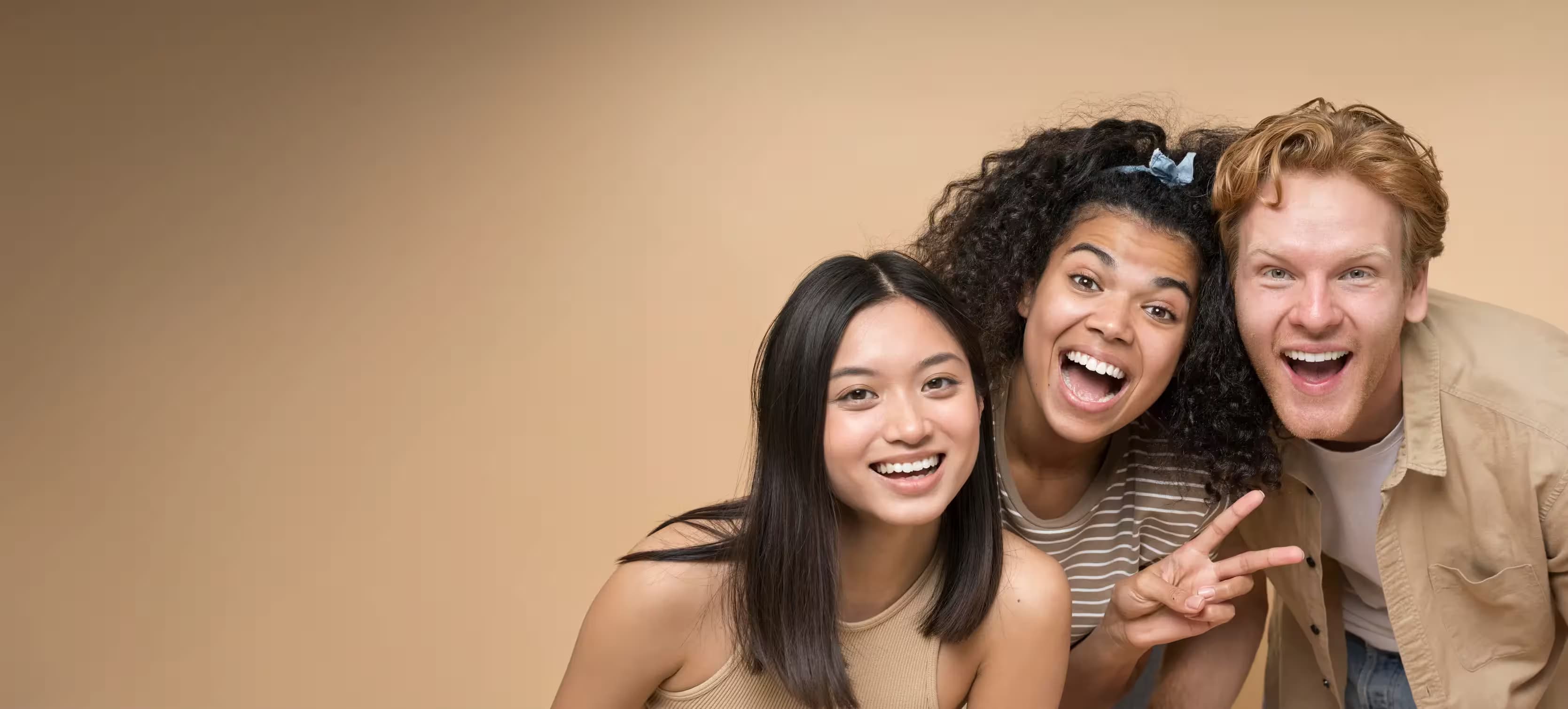 Three people smiling